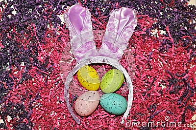 Easter Eggs and Bunny Ears on Confetti Stock Photo