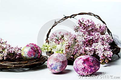 Easter eggs and colorful lilac flowers Stock Photo