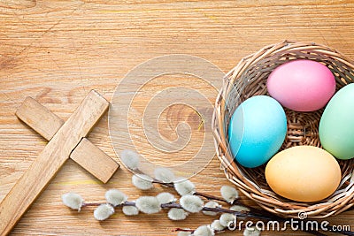 Easter eggs and cross on abstract wooden spring background Stock Photo