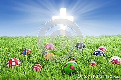 Easter eggs and Cross on grass Stock Photo