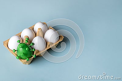 Easter eggs with a green egg decorated as coronavirus. Easter creative concept Stock Photo