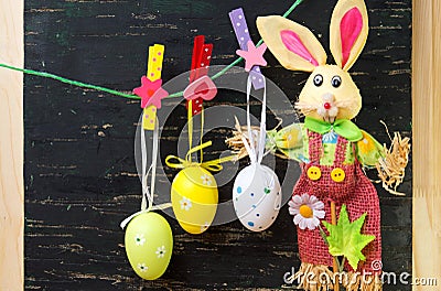 Easter eggs hanging from a string and a bunny Stock Photo