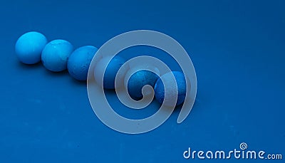 Easter eggs layout on blue background. ombre effect Stock Photo