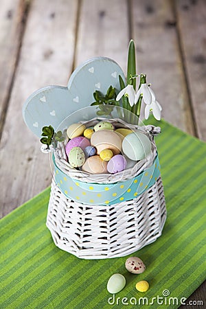 Easter eggs in the white basket Stock Photo