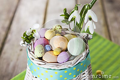 Easter eggs in the white basket Stock Photo