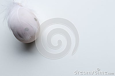 Easter egg with feater and wood beads Stock Photo