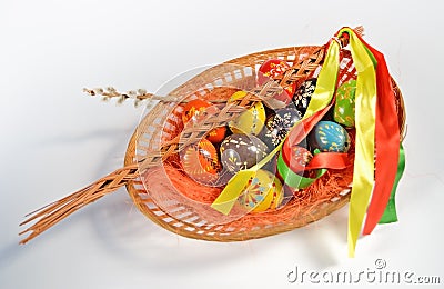 Easter eggs in wicker basket Stock Photo