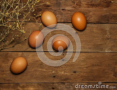 Easter eggs on a wooden table. View from above. Eggs chicken on a wooden table. Egg. Stock Photo