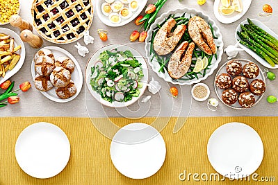 Easter festive table with salmon, asparagus, salad, potato, muffins and berry pie Stock Photo