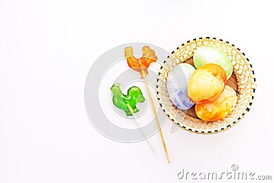 Easter fun painted eggs with chiken lollipops Stock Photo