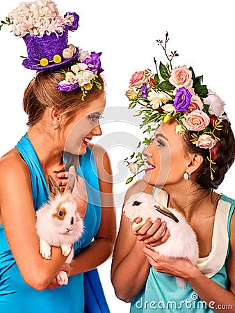 Easter girl together holding bunny. Women in holiday style. Stock Photo