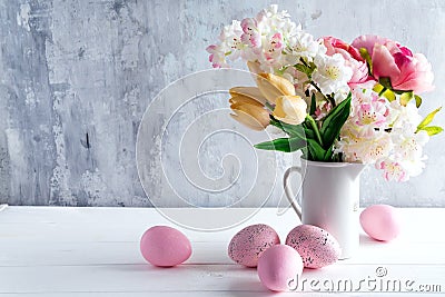 Easter greeting card backdrop with colorful spring flowers on white background. With copy space Stock Photo