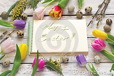 Easter greeting card with tulips, eggs, willow and mimosa Stock Photo