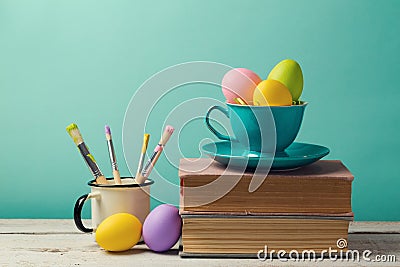 Easter holiday celebration with handmade painted eggs in coffee cup. Stock Photo
