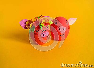 Easter holiday concept with cute handmade eggs: pink pig. Friends piglets Stock Photo