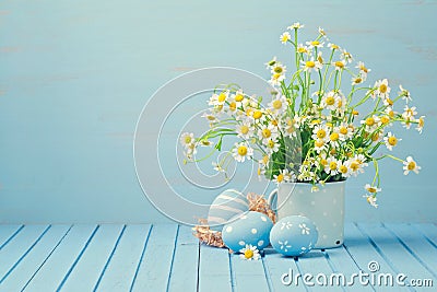 Easter holiday decoration with daisy flowers and painted eggs Stock Photo