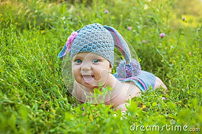 Easter holidays! Cute baby in a Easter bunny of lamb costume Stock Photo