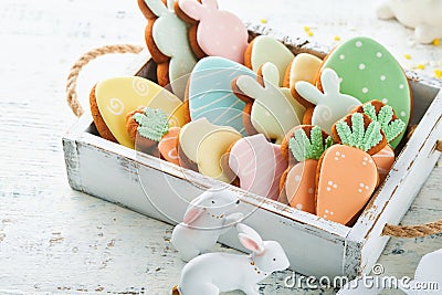 Easter homemade gingerbread rabbits, carrots, chickens and eggs icing cookies. Festive holiday sweet food concept. Easter baking Stock Photo