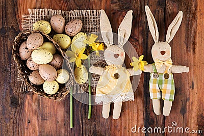 Easter lovely sweet bunny decoration over old wood Stock Photo