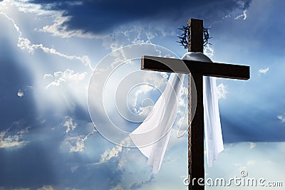 Easter Morning Sunrise with Cross, Burial Cloth, Crown of Thorns and Blue Sky Stock Photo