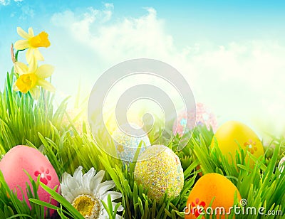 Easter nature spring scene background. Beautiful colorful eggs in spring grass meadow Stock Photo