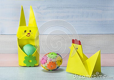 Easter paper bunny made in the origami technique - like a stand for eggs. Easter concept Stock Photo