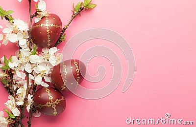 Easter pink background with Easter eggs and spring flowers. Top view with copy space Stock Photo