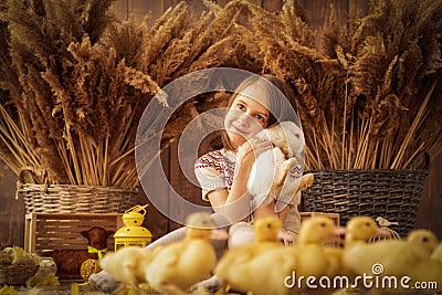 Easter portrait of hapy young beautiful girl with white rabbit. Horizontal image Stock Photo