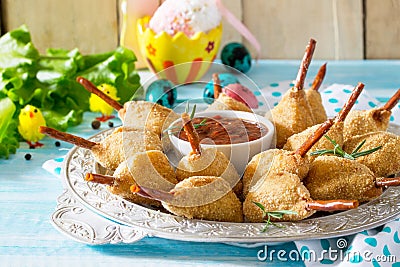 Easter recipe, festive appetizer. Meat in biscuits, deep fried served with ketchup sauce Stock Photo