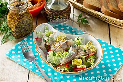 Easter recipe, festive snack. Salad with Pekinese cabbage, herring, sweet pepper and onions - on the festive table Stock Photo