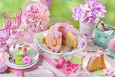 easter ring cake with pink icing and butterfly shaped sugar sprinkles Stock Photo