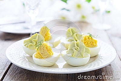 Easter snack^ Eggs stuffed with cheese and avocado mousse Stock Photo