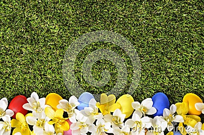 Easter spring flower and eggs border, green grass copy space Stock Photo