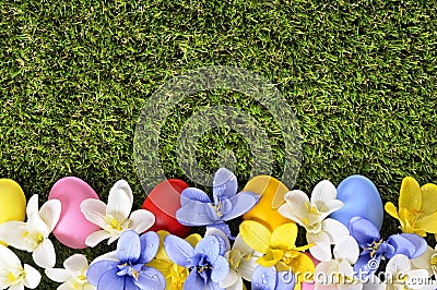 Painted easter eggs spring flower border, green grass copy space Stock Photo