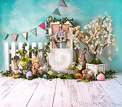 Easter spring sett up with colourful flowers pink flowers,bunny and easter eggs and vintage wood parquet Stock Photo