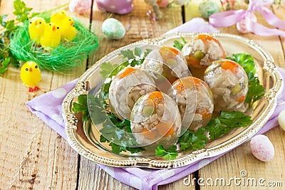 Easter treats: Easter Jellied eggs on a wooden table, jelly meat. Stock Photo