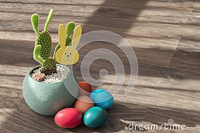 Easter view: cactus with yellow decorative wooden rabbit Stock Photo