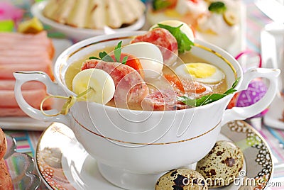 Easter white borsht with quil eggs and sausage Stock Photo