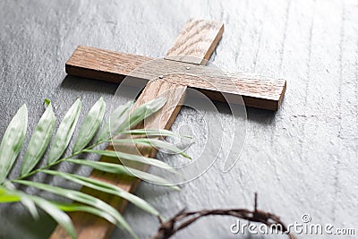 Easter wooden cross on black marble background religion abstract palm sunday concept Stock Photo