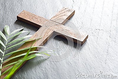 Easter wooden cross on black marble background religion abstract palm sunday concept Stock Photo