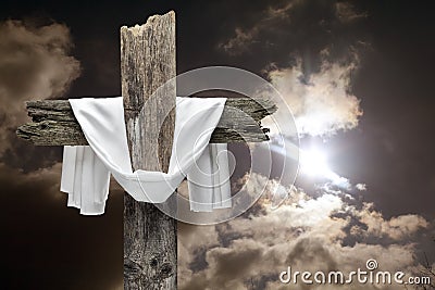 Easter cross on dramatic sky. He is risen concept. Stock Photo