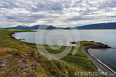 Eastern coastline of Eyjafjordur as viewed in the south dirrection in approach of Svalbardseyri locality in North of Iceland Stock Photo