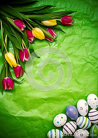 Eastern egg, tulips on green crumpled wrapping paper Stock Photo