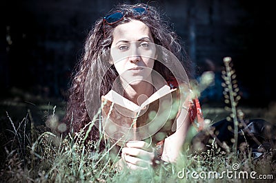 Eastern hipster vintage woman reading book Stock Photo