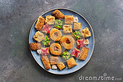 Eastern sweets in a blue plate on a dark gray background. Top view, flat lay, copy space Stock Photo