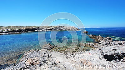 Eastern view of Favaritx beach, one of the most beautiful spots in Menorca, Balearic Islands, Spain Stock Photo