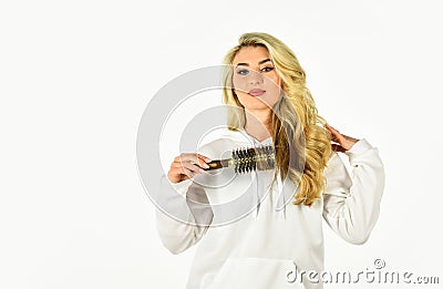 Easy hairdo. Beauty supplies. Use with hairdryer to create styling. Hot curling brush. Pretty woman brushing hair Stock Photo