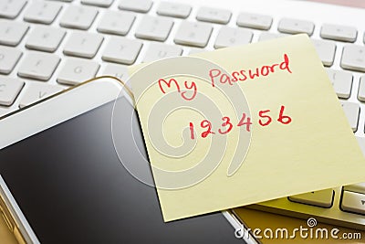 Easy number password note stick on smartphone, keyboard Stock Photo
