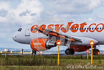 Easyjet aircraft behind landing lights Editorial Stock Photo