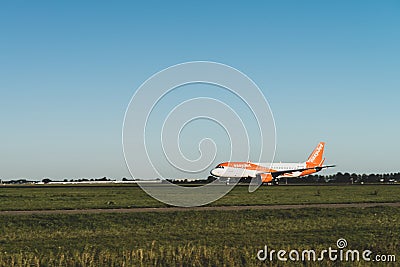 EasyJet airplane is ready to take off from the runway, Airbus A320, runway Polderbaan Editorial Stock Photo